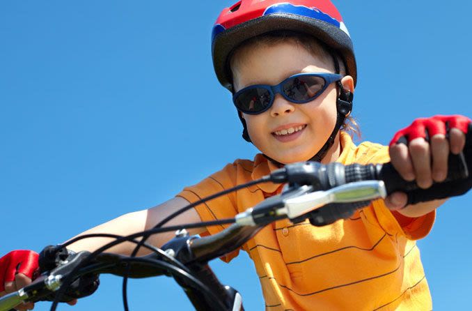 Child wearing protective sunglasses