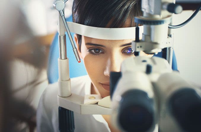 Woman taking an eye exam